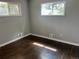Comfortable bedroom featuring hardwood floors, natural light, and neutral-colored walls at 1283 Lipan Dr, Denver, CO 80221