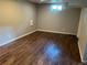 Bedroom with hardwood flooring and one window providing natural light at 1283 Lipan Dr, Denver, CO 80221