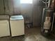 Laundry room with washer, dryer, and water heater at 1283 Lipan Dr, Denver, CO 80221