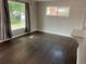 Cozy living room with hardwood floors, natural light, and views of the front yard at 1283 Lipan Dr, Denver, CO 80221