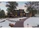 Exterior of a two-story house with a walkway leading to the entrance, surrounded by snowy landscaping at 9673 Huggins Ct, Parker, CO 80134