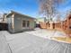 Large backyard with detached shop and snow covered patio at 1922 Mount Sneffels St, Longmont, CO 80504