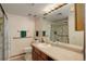 Well-maintained bathroom with a glass enclosed shower, neutral color palette, and spacious vanity at 3675 S Cherokee St # 710, Englewood, CO 80110