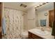 Clean bathroom features a shower-tub combo, classic vanity with mirror, and attractive fixtures at 3675 S Cherokee St # 710, Englewood, CO 80110