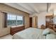 Cozy bedroom featuring classic decor, ample natural light, and comfortable furnishings at 3675 S Cherokee St # 710, Englewood, CO 80110