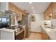 Bright kitchen featuring stainless steel appliances, light wood cabinetry, and elegant countertops at 3675 S Cherokee St # 710, Englewood, CO 80110