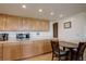 Cozy kitchen features oak cabinets, quartz countertops, and breakfast table at 3675 S Cherokee St # 710, Englewood, CO 80110