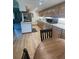 Open kitchen boasts light wood cabinets, modern appliances, and wood floors, creating a cozy atmosphere at 3675 S Cherokee St # 710, Englewood, CO 80110