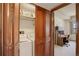 Laundry closet with washer and dryer located off home office area at 3675 S Cherokee St # 710, Englewood, CO 80110