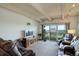 Inviting living room with sliding glass doors, open floor plan, and comfortable seating area at 3675 S Cherokee St # 710, Englewood, CO 80110