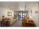 Comfortable lobby space with a couch, leather chairs, and plants at 3675 S Cherokee St # 710, Englewood, CO 80110
