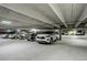 Bright, underground parking garage featuring multiple parking spots and visible lighting at 3675 S Cherokee St # 710, Englewood, CO 80110
