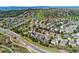 Scenic aerial view of a neighborhood near a golf course, showcasing the landscape at 534 Stonemont Dr, Castle Pines, CO 80108
