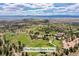Beautiful aerial view of The Ridge at Castle Pines golf course and surrounding landscape at 534 Stonemont Dr, Castle Pines, CO 80108
