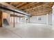 Unfinished basement with exposed ceiling and framed walls, offering potential for customization at 534 Stonemont Dr, Castle Pines, CO 80108