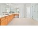 Bathroom featuring a spacious vanity, glass enclosed shower, and soaking tub at 534 Stonemont Dr, Castle Pines, CO 80108