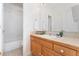 Clean bathroom with a shower-tub combination, large mirror, and light wood cabinets at 534 Stonemont Dr, Castle Pines, CO 80108