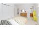 Well-lit bedroom featuring a large closet and view of the ensuite bathroom at 534 Stonemont Dr, Castle Pines, CO 80108