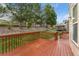 Expansive wooden deck offers an outdoor living area overlooking the landscaped backyard at 534 Stonemont Dr, Castle Pines, CO 80108