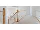 Upper hallway featuring carpeted floors, wood trim, and staircase leading down to the lower level at 534 Stonemont Dr, Castle Pines, CO 80108