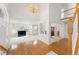 Spacious living area featuring high ceilings, an elegant chandelier, and hardwood floors, ideal for entertaining at 534 Stonemont Dr, Castle Pines, CO 80108
