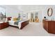 Inviting main bedroom with neutral decor, a king-size bed, and several large windows at 534 Stonemont Dr, Castle Pines, CO 80108
