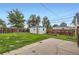 Spacious backyard with a shed, lawn, and wood fence at 5090 Tejon St, Denver, CO 80221