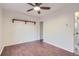 Cozy bedroom with wood floors, ceiling fan, and natural light from doorway at 5090 Tejon St, Denver, CO 80221