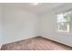 Well-lit bedroom with wood floors and a window offering natural light and ventilation at 5090 Tejon St, Denver, CO 80221