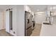 Open kitchen featuring stainless steel refrigerator, modern cabinets, and wood-style floors at 5090 Tejon St, Denver, CO 80221