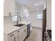 Stylish kitchen with ample counter space, stainless steel appliances, and wood-look floors at 5090 Tejon St, Denver, CO 80221