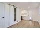 Modern kitchen with white cabinetry and stainless steel appliances, open to living space at 5090 Tejon St, Denver, CO 80221