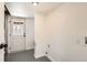 Basement with a white exterior door leading outside and utility connections at 5203 Scranton St, Denver, CO 80239