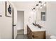 Bright bathroom with a double vanity, contemporary fixtures, and modern decor at 5203 Scranton St, Denver, CO 80239