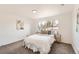 Cozy bedroom featuring a large window, plush carpeting, and neutral decor with stylish accent pieces at 5203 Scranton St, Denver, CO 80239