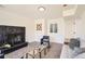 Inviting living room with modern fireplace, neutral walls, and carpet, and seating at 5203 Scranton St, Denver, CO 80239