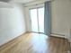 Empty bedroom with hardwood floors and a sliding glass door at 1633 18Th St St # 2, Boulder, CO 80302
