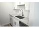 Modern kitchen featuring granite countertops, white cabinets, and a stainless steel sink at 1633 18Th St St # 2, Boulder, CO 80302