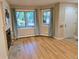 Bright living room featuring wood floors, a fireplace, and large windows at 1633 18Th St St # 2, Boulder, CO 80302