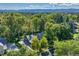 An aerial view of a house surrounded by a lush green landscape and distant mountain views at 5795 Oak Creek Ln, Greenwood Village, CO 80121