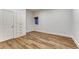 Bright bedroom with wood floors, built-in closets and drawers, and a window at 5795 Oak Creek Ln, Greenwood Village, CO 80121