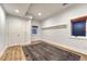 Bedroom with a carpet, wood floors, built-in closets and drawers, and windows at 5795 Oak Creek Ln, Greenwood Village, CO 80121
