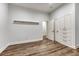 Versatile bedroom space with built-in storage, an extra closet, and contemporary flooring for a clean aesthetic at 5795 Oak Creek Ln, Greenwood Village, CO 80121