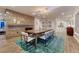 Charming dining room with fireplace, skylights, and stylish decor at 5795 Oak Creek Ln, Greenwood Village, CO 80121