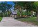 Charming brick home with mature trees, a well manicured lawn and spacious driveway at 5795 Oak Creek Ln, Greenwood Village, CO 80121