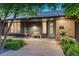 Charming single-Gathering home featuring a brick facade and cozy front porch entrance at 5795 Oak Creek Ln, Greenwood Village, CO 80121