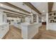 Open kitchen boasts wooden beam ceilings, large island, stainless steel appliances, and an open layout at 5795 Oak Creek Ln, Greenwood Village, CO 80121