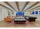 Spacious living room with exposed wood beams, skylights, and plush seating at 5795 Oak Creek Ln, Greenwood Village, CO 80121