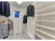Well-organized walk-in closet featuring custom shelving and drawer storage for optimal organization at 5795 Oak Creek Ln, Greenwood Village, CO 80121