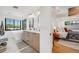 Bright bathroom with double vanity, soaking tub, and black window frames showing off the view at 2540 Jay St, Edgewater, CO 80214